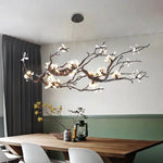 suspension luminaire branches cuivre fleurs artificielles moderne noir blanc salon salle manger intérieur