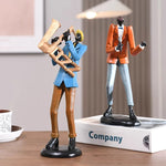 statues miniatures musiciens guitare saxophone trombone batterie décoration intérieure moderne stylisée