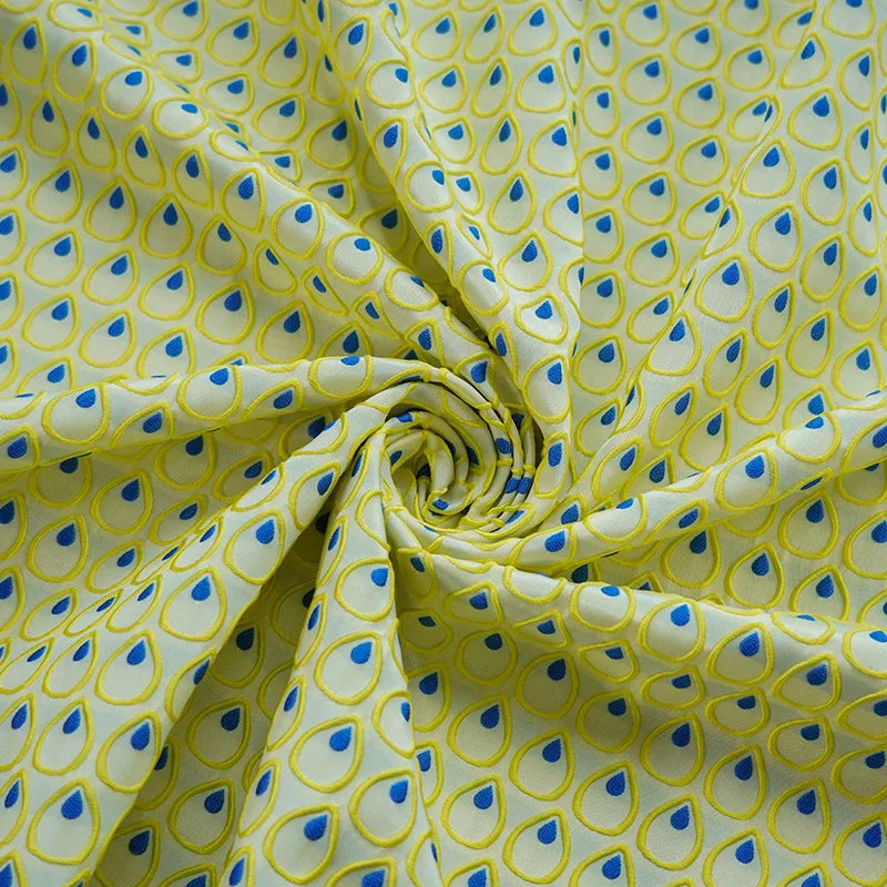 tissu polyester jaune bleu motif gouttes plumes decoratif moderne largeur 150cm graphique Jacquard