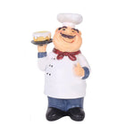 figurine cuisinier cartoon blanc gris rouge texture résinée brillante assiettes fruits spatule cuillère
