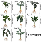 ornement décoration intérieure plante artificielle feuilles larges racines visibles vert foncé points blancs