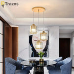 suspension lumineuse trois lumières cristal or moderne abat jour transparent chambre salon contemporain