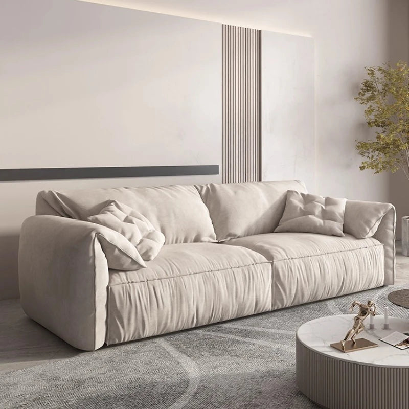 canapé salon contemporain beige doux coussins minimaliste moderne fixations pieds