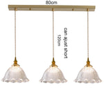 suspension lumineuse vintage vert doré motifs géométriques ampoules câbles chaînes métal