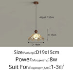 lampe suspendue moderne doré beige translucide texture ondulée motif floral câble noir réglable chambre