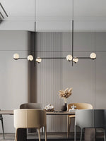 suspension lumineuse moderne sphères blanches structure noire led neutre lumière blanc noir