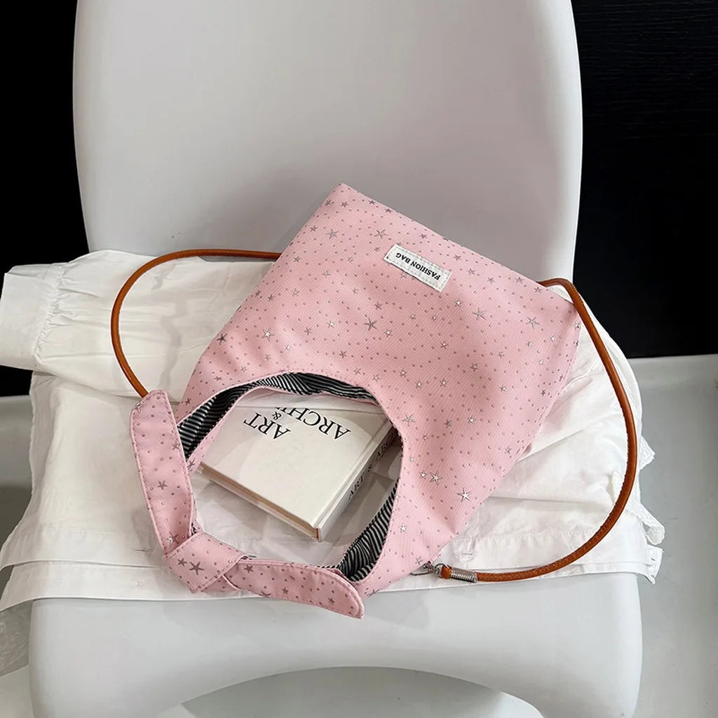 sac main femme rose clair étoiles dorées doux moderne casual tote toile