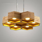 lumière suspendue bois clair nid d'abeille hexagonal modernes led câbles argentés structure géométrique