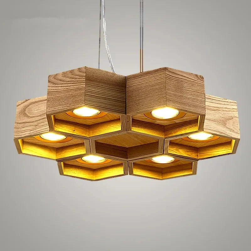lumière suspendue bois clair nid d'abeille hexagonal modernes led câbles argentés structure géométrique