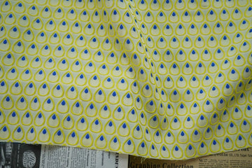 tissu polyester jaune bleu motif gouttes plumes decoratif moderne largeur 150cm graphique Jacquard