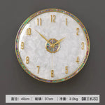 horloge murale moderne or blanc cadran marbré aiguille salon étude