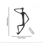 statues modernes minimalistes figures humaines assises noir texture brut forge lunettes livresintérieur