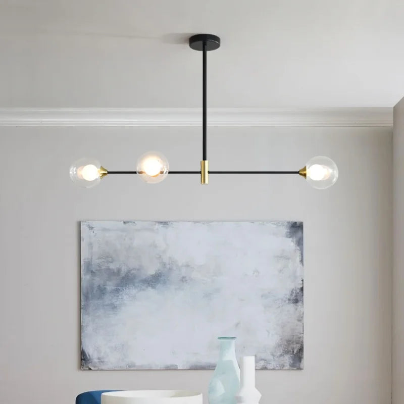 suspension lumineuse moderne minimaliste noir doré blanc sphères translucides métal poli