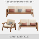 canapé places scandinave beige clair fauteuil pied poule moderne tapis géométrique terracotta blanc