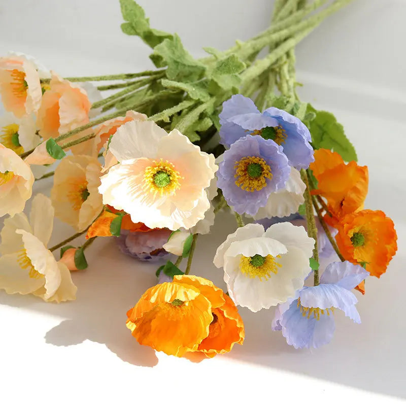 bouquet fleurs artificielles moderne mariage intérieur blanc jaune orange bleu feuilles vertes