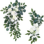 arche decorative mariage fleurs roses blanches feuilles vertes tissu transparent bouquets romantique champetre