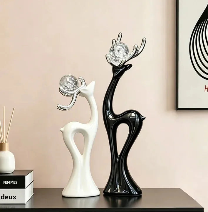 statues cerfs noir blanc sphères verre argentées décoration moderne salon meuble tv armoire vin