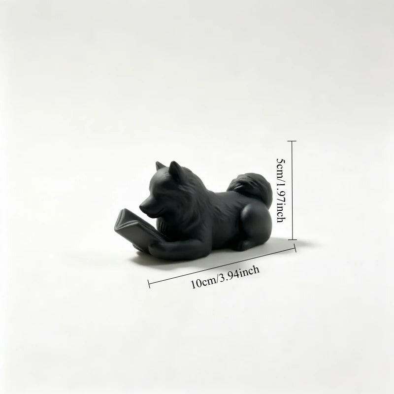 statue chien couché livre ouvert blanc noir décoration intérieur 10cm longueur 5cm hauteur festive