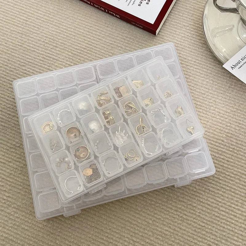 boîte rangement bijoux transparente moderne clips respectueux environnement compartments boucles oreilles pendentifs chaînes
