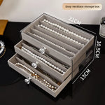 boîte bijoux velours beige clair poignées moderne rangement colliers bagues montres boucles d'oreilles
