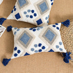 housse coussin carré boho chic motifs géométriques pompons couleur neutres décor maison