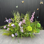 décoration murale naturelle composition florale variée couleurs vives rustique bienvenue mariage