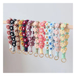 bracelet porte clés fleurs relief tissé jaune vert blanc rose bleu violet rouge vif