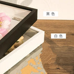 cadre photo moderne résine carré posé table mur blanc noir éléments naturels