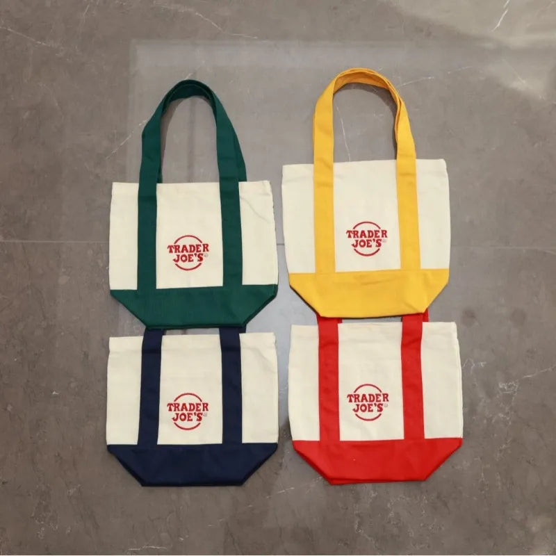 sac main toile verte rouge blanc jaune trader joes logo poignées simple pratique
