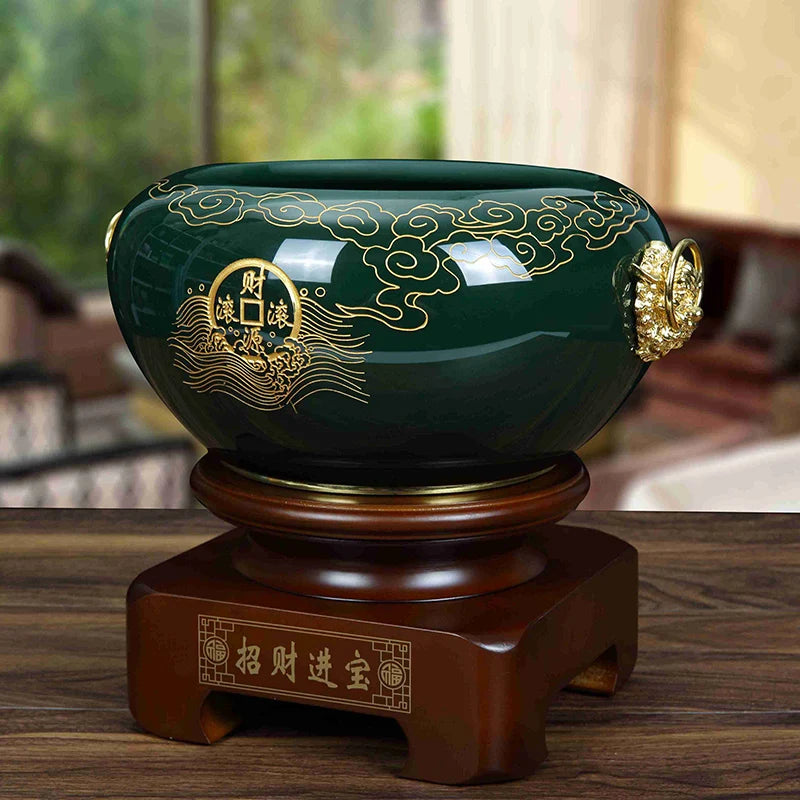 cache pot vert foncé ornementation dorée motifs floraux artisanal salon table decoration métal bois