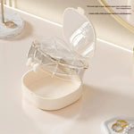 boîte bijoux transparente moderne blanc violet rose compartiments miroir rangement voyage