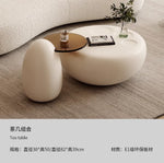 canapé lit blanc bouclé moderne table basse coussins décoratifs