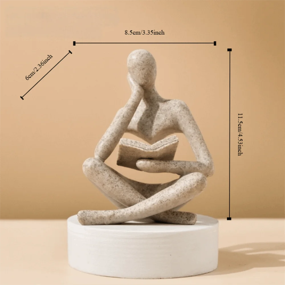 figurine deco moderne or noir blanc personne assise livre socle chambre abstraction minimalisme