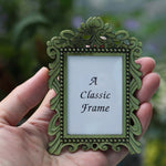 cadre photo pied bronze argenté vintage décor floral complexe métal ornementé