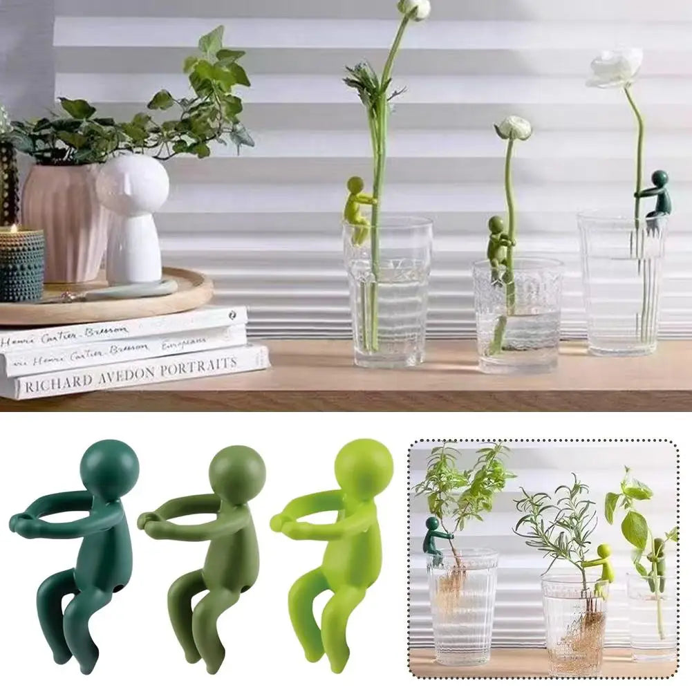figurines humaines articulées vert plantes grimpantes vase décoration intérieure minimaliste moderne ludique