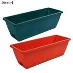 pots fleurs modernes fonctionnels couleurs vert orange gris beige bleu poignée métallique auto absorbants