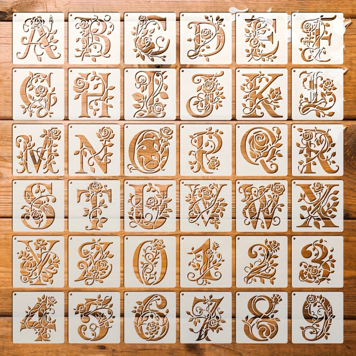 pochoirs lettres chiffres blancs motifs roses feuilles transparents vintage clous inclusionscrição