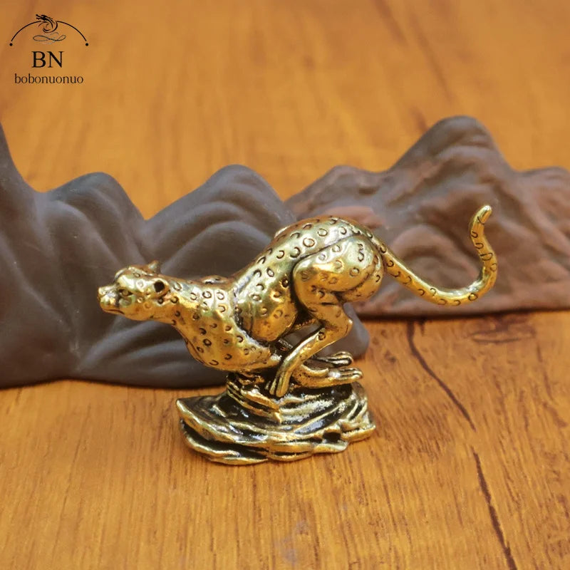statuette léopard doré taches marron clair base vague artisanat décoration maison traditionnelle asiatique