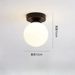 lampe moderne verre transparent noir doré élégante sphérique éclairage contemporain