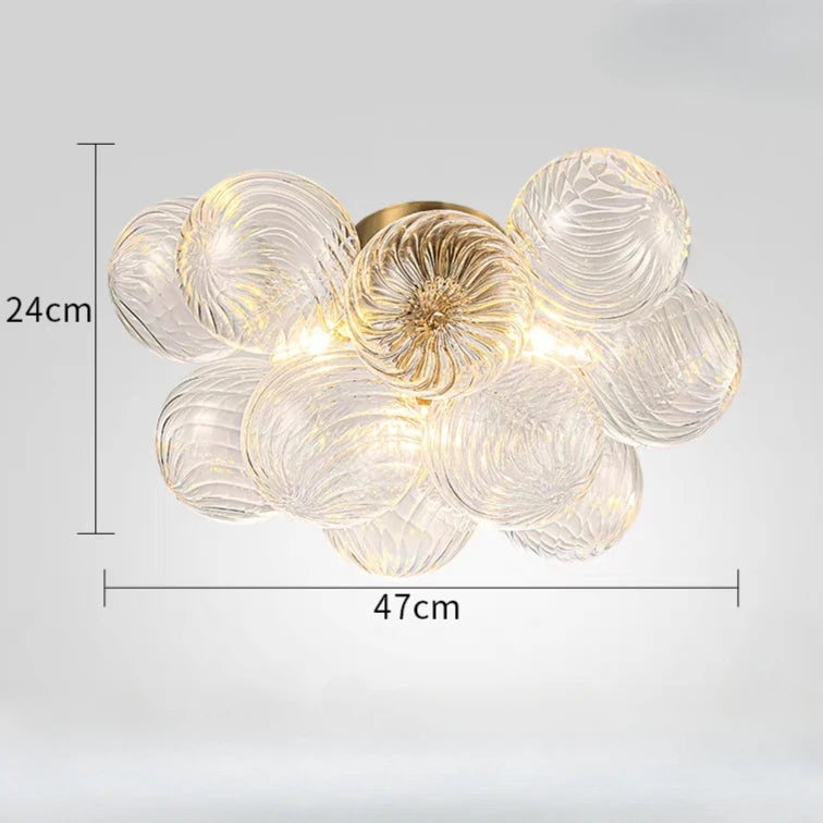 suspension lumineuse moderne verre transparent chaîne dorée led acier poli contemporain lumière chaude chambre