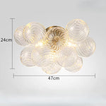 suspension lumineuse moderne verre transparent chaîne dorée led acier poli contemporain lumière chaude chambre
