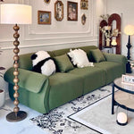 canapé vert olive moderne tissu uni bois coussins décoratifs sectionnel français minimaliste
