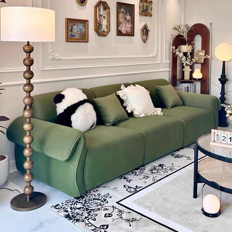 canapé vert olive moderne tissu uni bois coussins décoratifs sectionnel français minimaliste