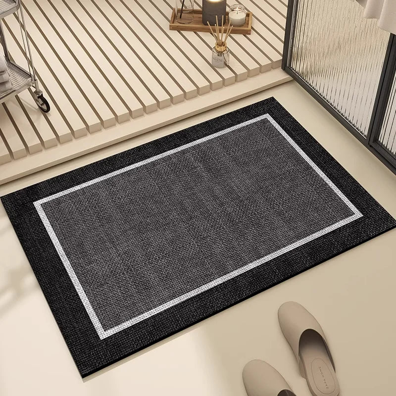 Tapis d'entrée noir et gris, style moderne, avec bordure blanche pour décorer et accueillir les visiteurs.