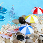 parasols miniatures décorations paysage moderne rouge blanc bleu jaune rayures horizontales tringle base circulaire