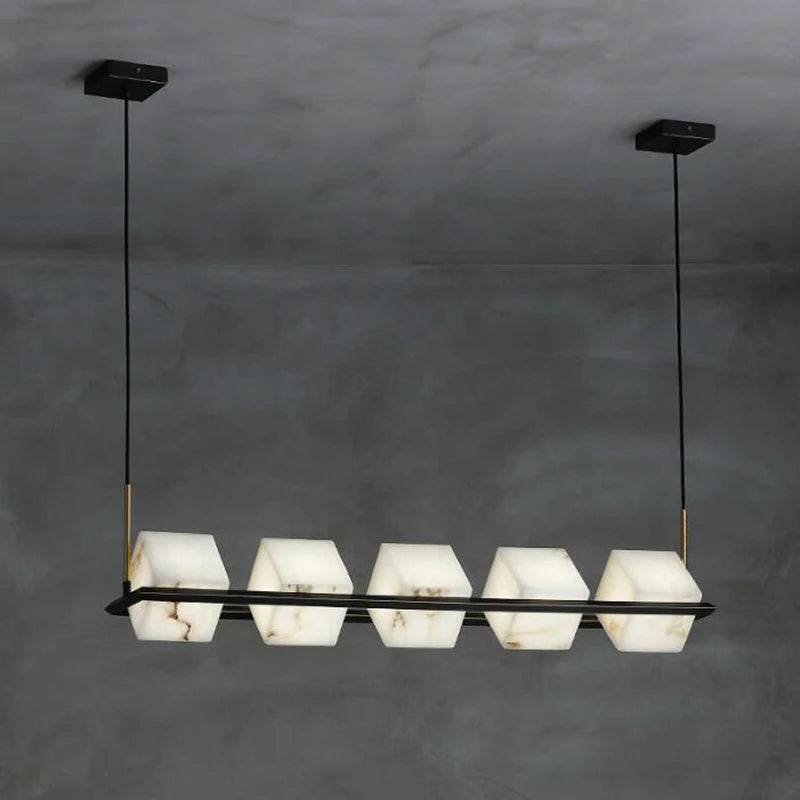 suspension lumineuse moderne marbre noir blanc or rose fixée câbles chambre salon