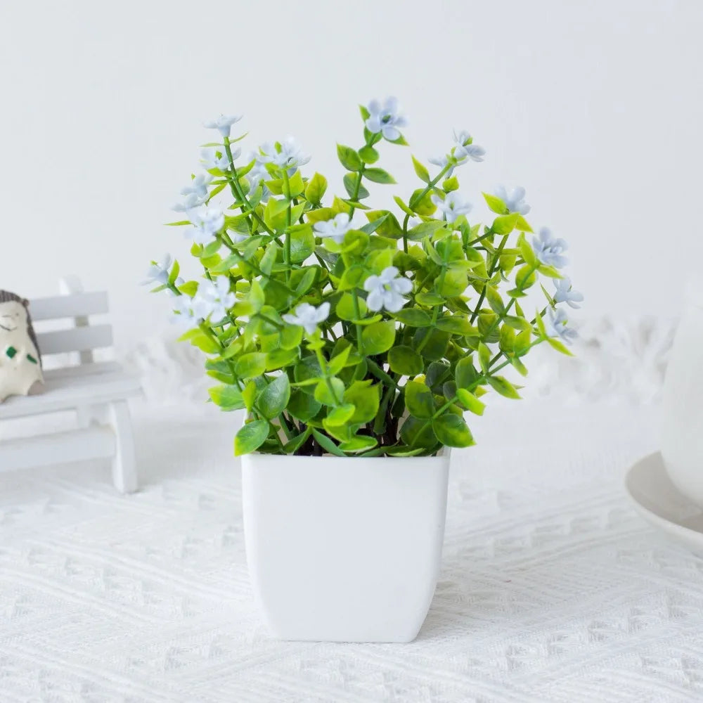 décoration extérieure plante artificielle moderne pot carré blanc branches feuilles vertes fleurs violettes minimalisteextérieur