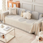 couverture canapé moderne rayures horizontales franges beige crème gris clair salon intérieur