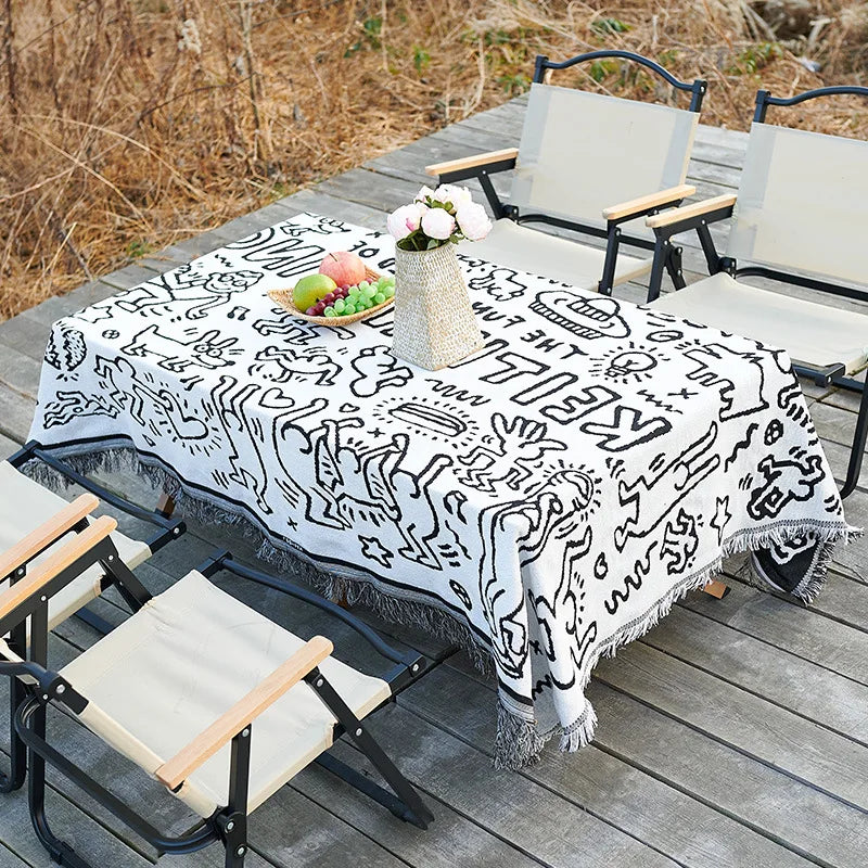 serviette table moderne ethnique motifs géométriques franges couleurs vives blanc bleu orange rouge noir