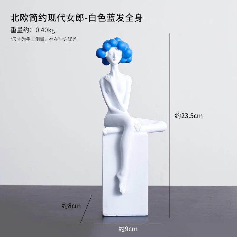 statuette décorative buste féminin noir blanc bleu or moderne minimaliste.surface lisse polie.formes arrondies socle